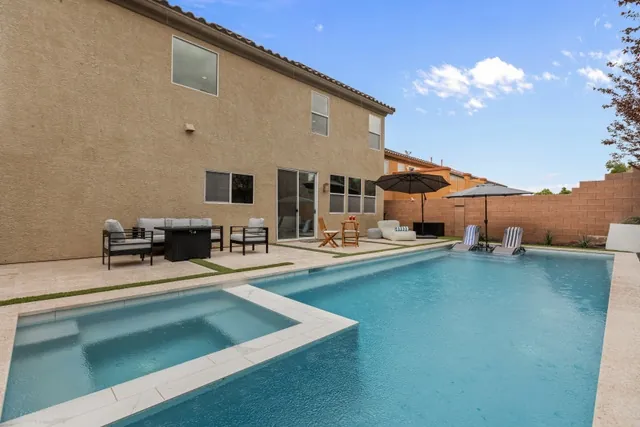Pool with spa and outdoor dining