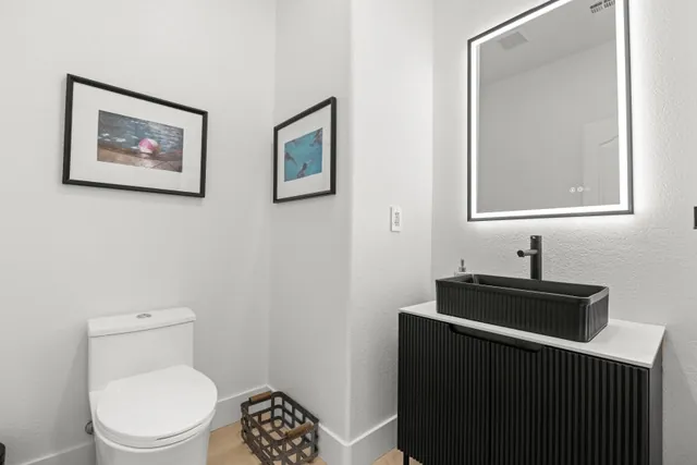 Powder room with fluted vanity